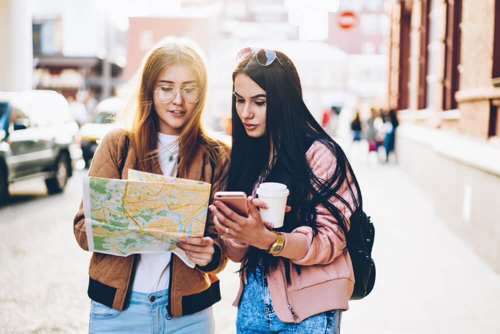 girls using an interactive map girls using an interactive map