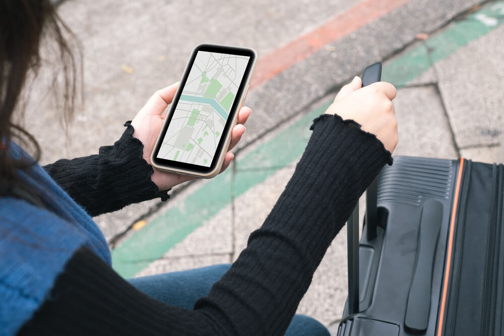 woman using an interactive map on mobile woman using an interactive map on mobile